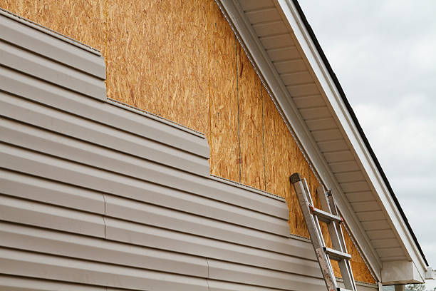 Professional Emergency Siding Repair technician working in Helmetta, NJ